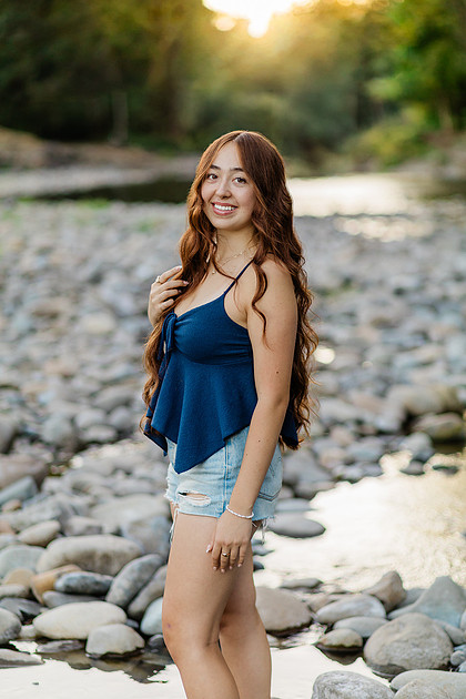 Girl senior athlete on a basketball court and by the river