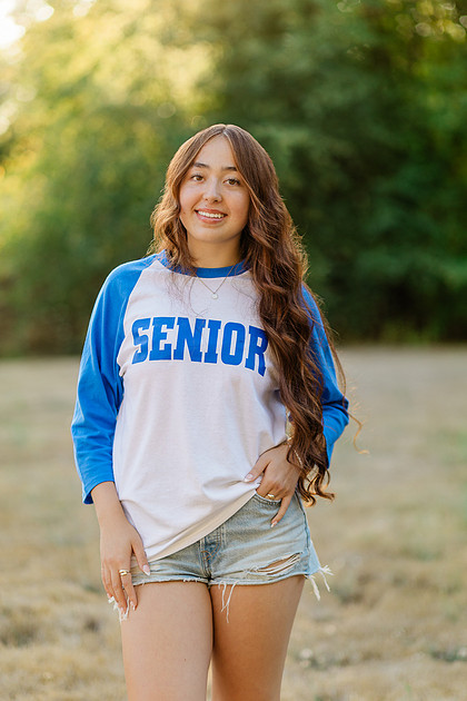 Girl senior athlete on a basketball court and by the river