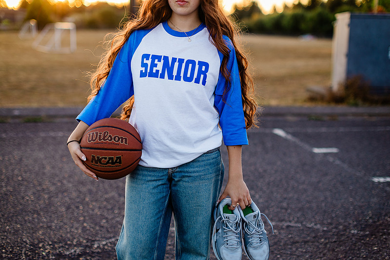 Girl senior athlete on a basketball court and by the river