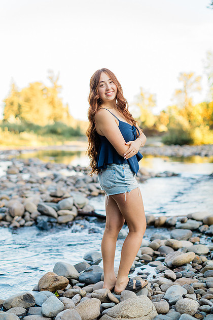 Girl senior athlete on a basketball court and by the river