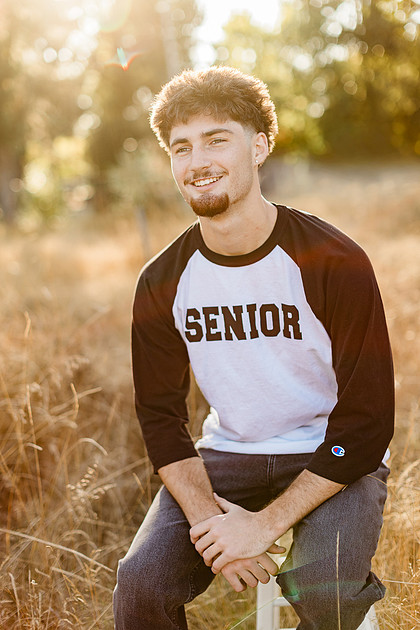 Senior boy by the Lewisville River in WA