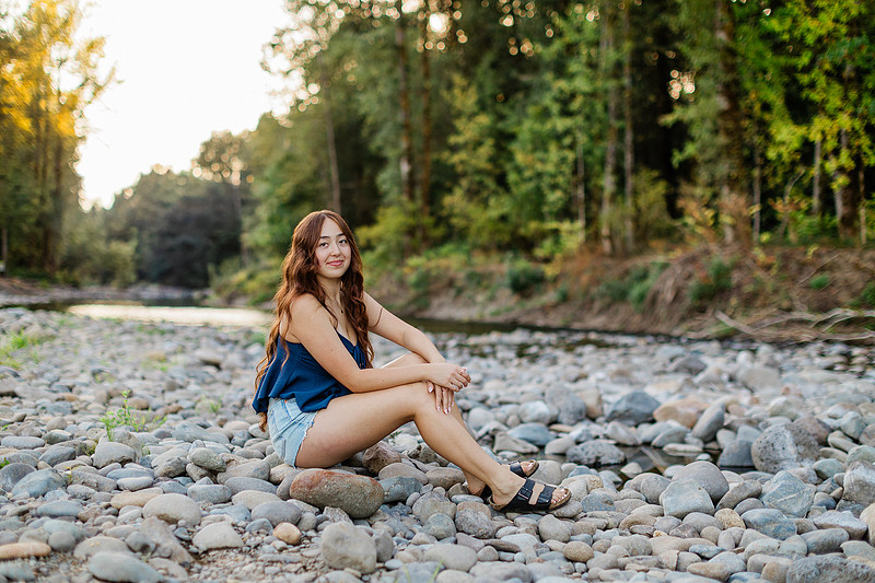 Girl senior athlete on a basketball court and by the river