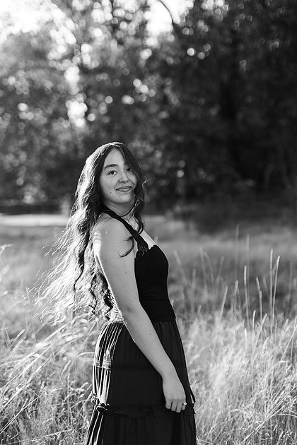 Girl senior athlete on a basketball court and by the river