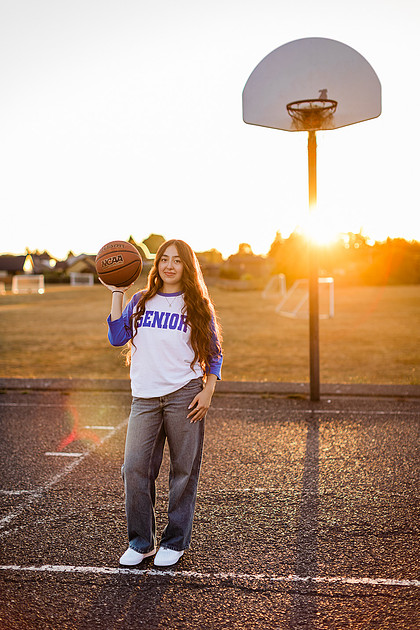 Girl senior athlete on a basketball court and by the river