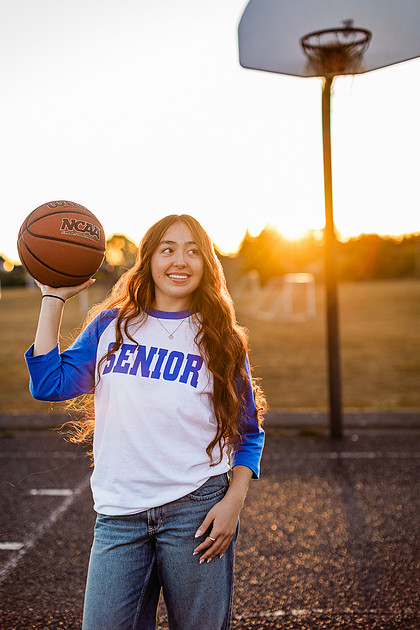Girl senior athlete on a basketball court and by the river
