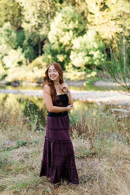 Girl senior athlete on a basketball court and by the river
