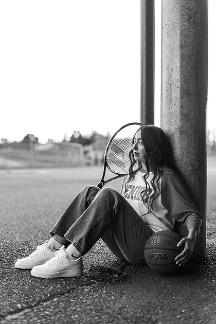 Girl senior athlete on a basketball court and by the river