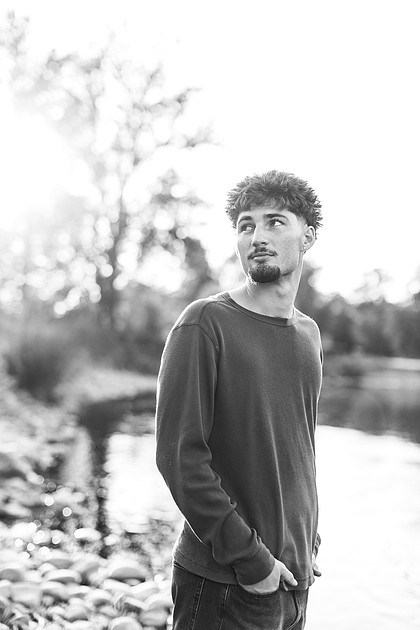 Senior boy by the Lewisville River in WA