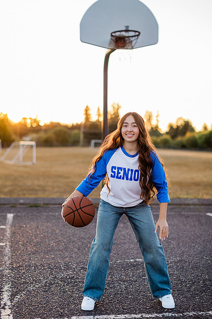 Girl senior athlete on a basketball court and by the river