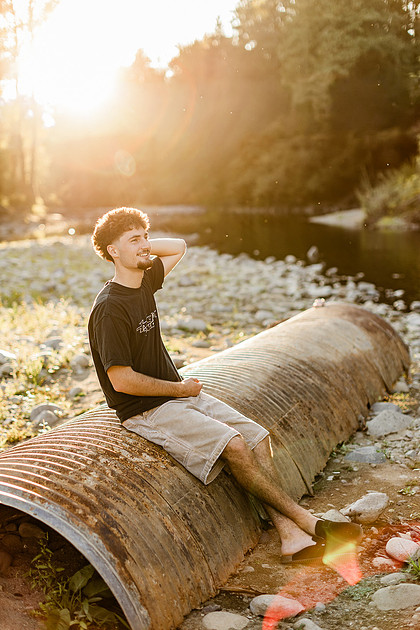 Senior boy by the Lewisville River in WA