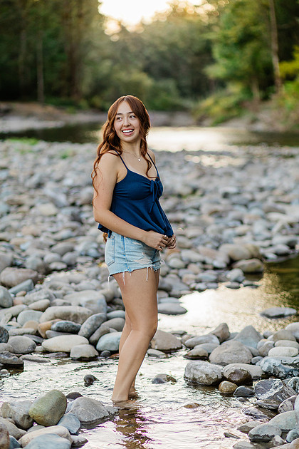 Girl senior athlete on a basketball court and by the river