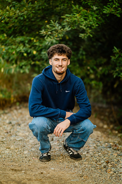 Senior boy by the Lewisville River in WA