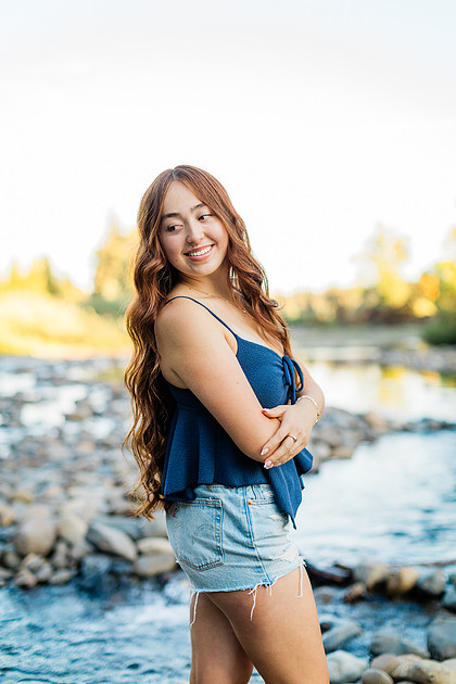 Girl senior athlete on a basketball court and by the river