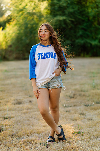 Girl senior athlete on a basketball court and by the river