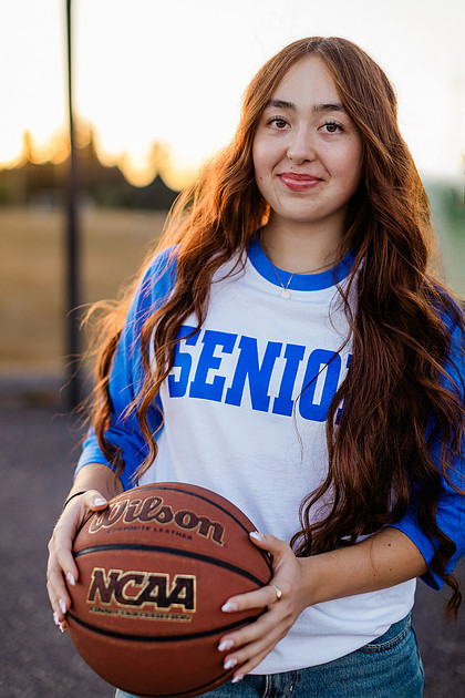 Girl senior athlete on a basketball court and by the river