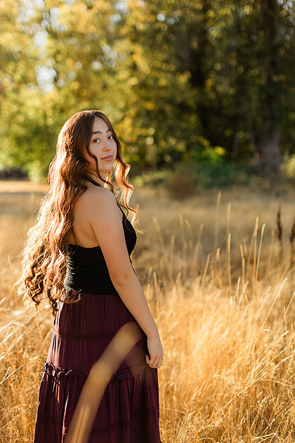 Girl senior athlete on a basketball court and by the river