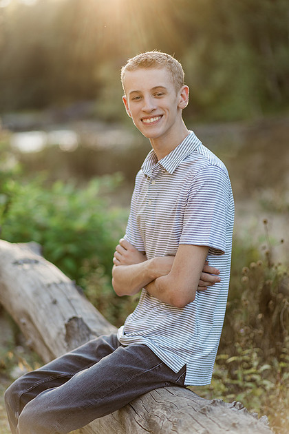 Senior boy by a river in Vancouver, WA
