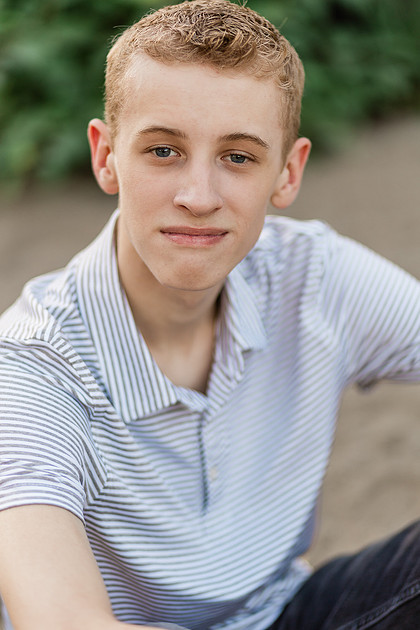 Senior boy by a river in Vancouver, WA
