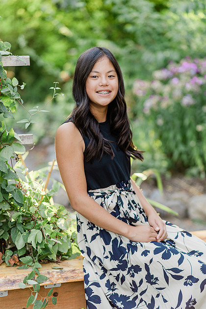 formal portraits of family of 5 in a garden