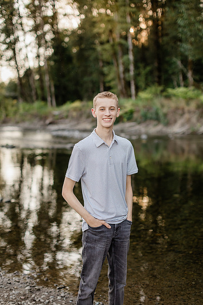 Senior boy by a river in Vancouver, WA