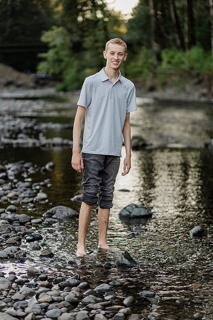 Senior boy by a river in Vancouver, WA