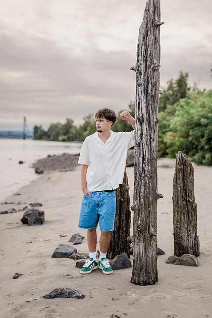 Senior boy by the Columbia River in downtown Vancouver, WA